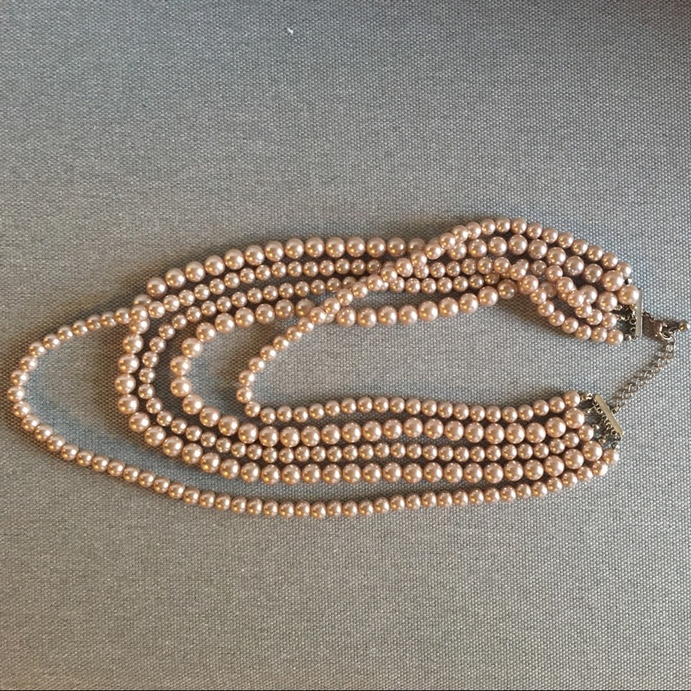 Multi strand faux pearl necklace.